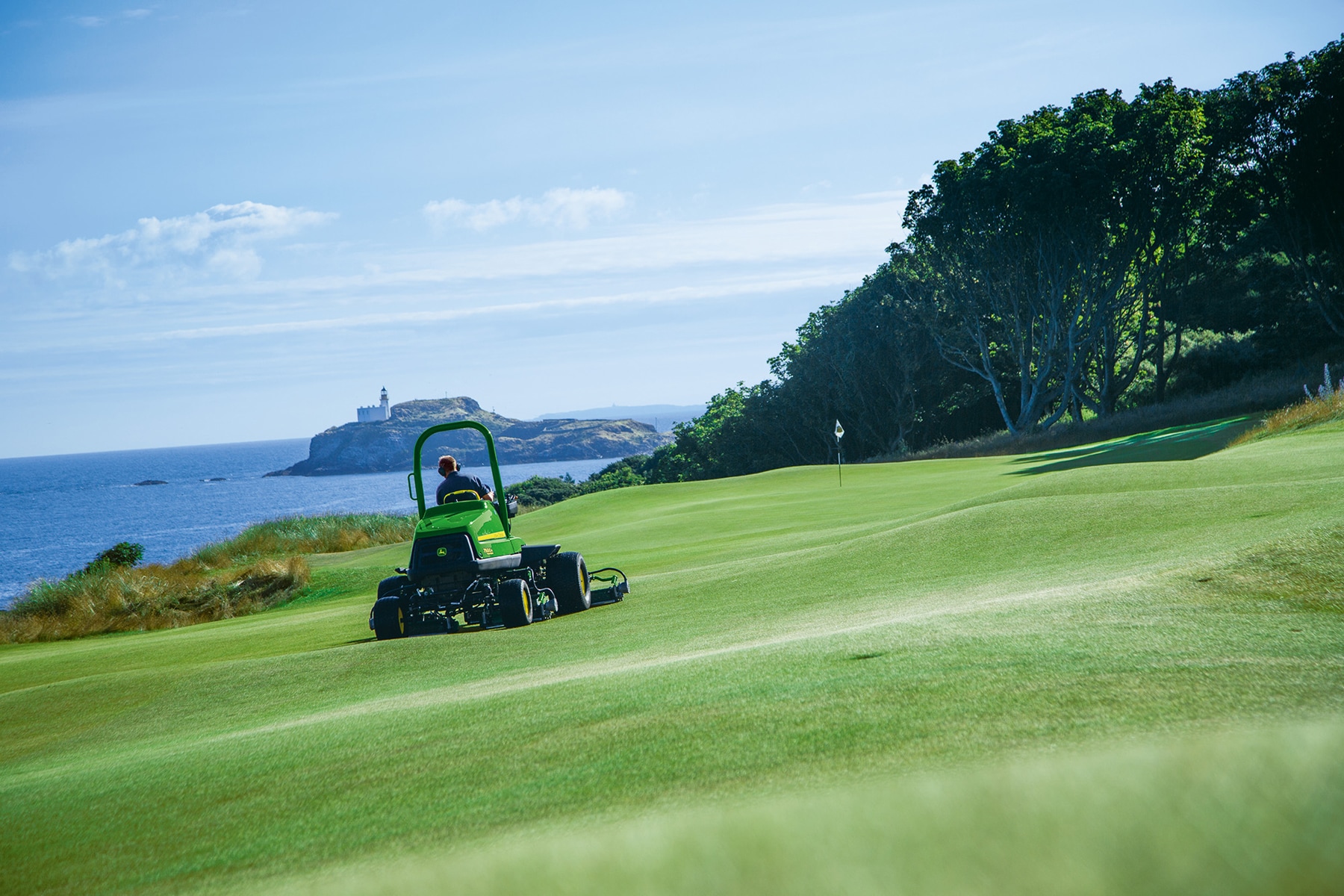 A John Deere 7500AE hybrid electric fairway mower working on the 10th hole (Championship 13th) at The Renaissance Club.